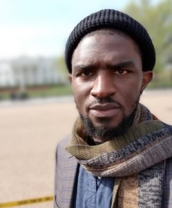 a headshot of the poet, IBe